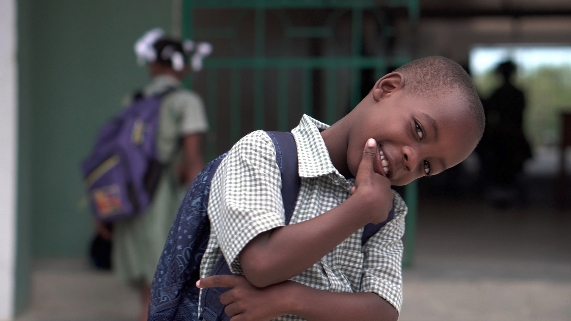 African American grade-school pupil smiling
